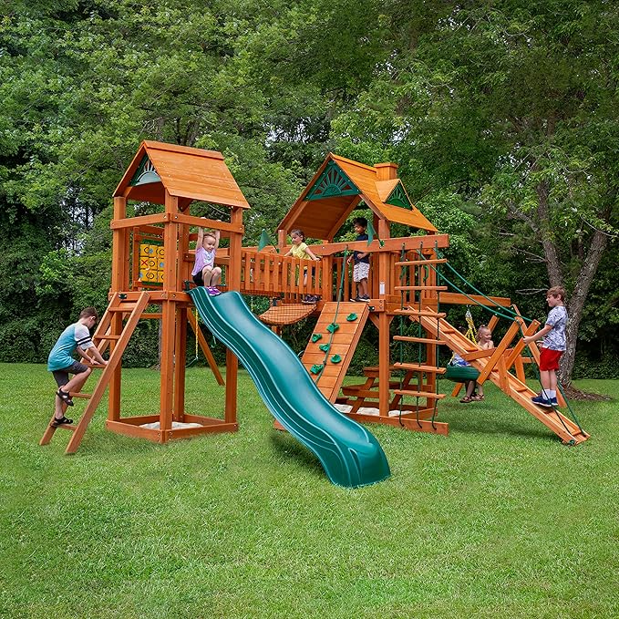 Gorilla Playsets Pioneer Peak Treehouse Wooden Swing Set with Tire Swing, and Clatter Bridge and Tower image 1